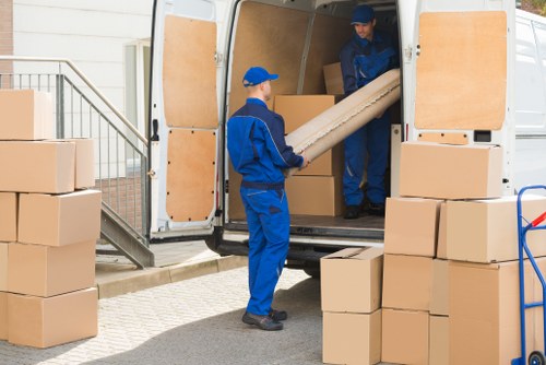 Moving van loading furniture in a Dutch city street