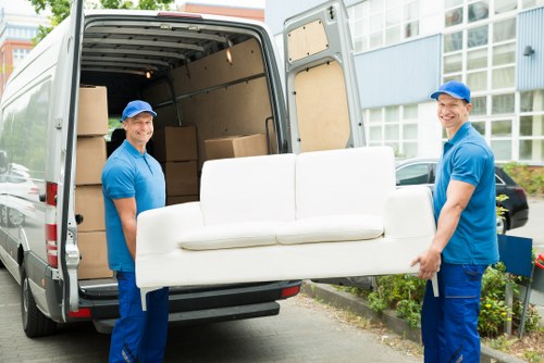 Removal team using safe lifting and planning procedures during a relocation
