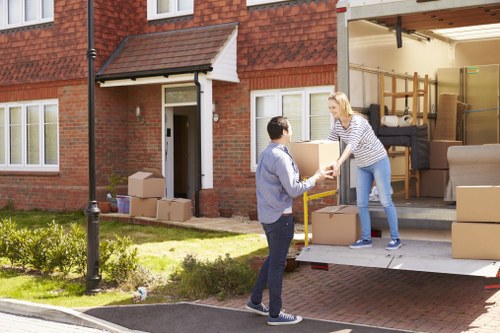 Man and van team loading furniture for a local move in the Netherlands