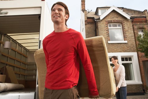 Removal team packing furniture safely in a Dutch home