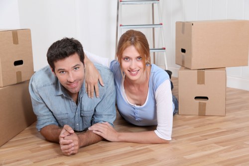 Removal crew loading boxes and furniture for an apartment move