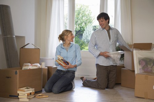 Furniture and boxes being unloaded from a van at a Dutch property