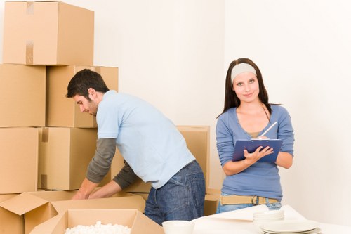 Moving team handling apartment access and stairs in a Dutch city