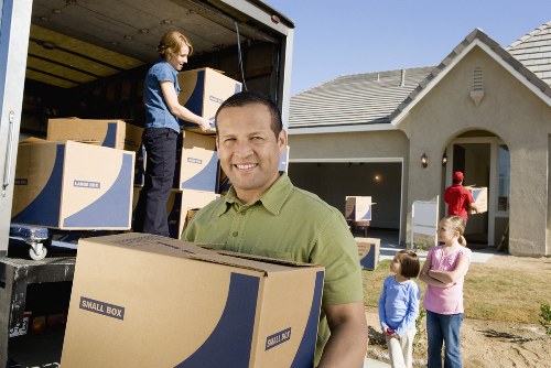 Moving team loading furniture into a van for a Netherlands relocation