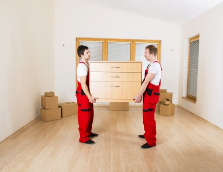 Movers handling office items and access planning during a Netherlands business relocation